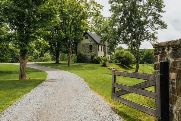 a view of a house with yard and a tree
