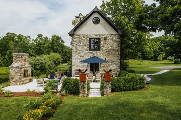 a front view of a house with garden