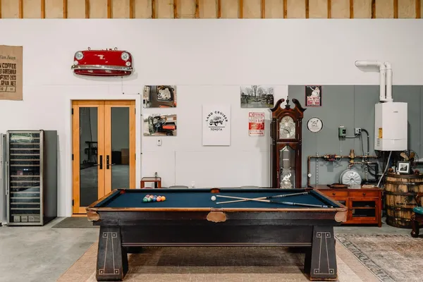 a room with furniture and air hockey table