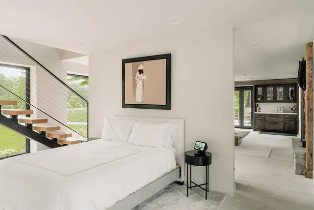 a bedroom with a bed and dresser