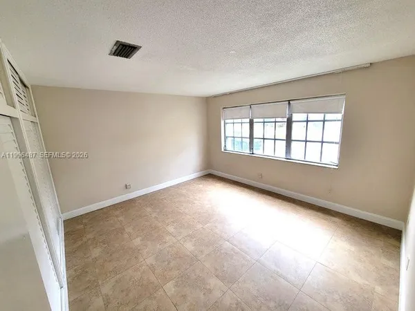 a bathroom with a toilet a sink and shower