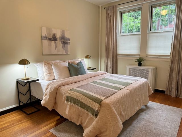 a bedroom with a bed and window