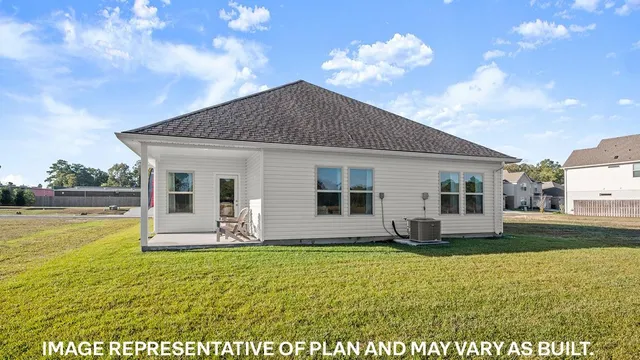 a front view of house with yard outdoor seating and barbeque oven