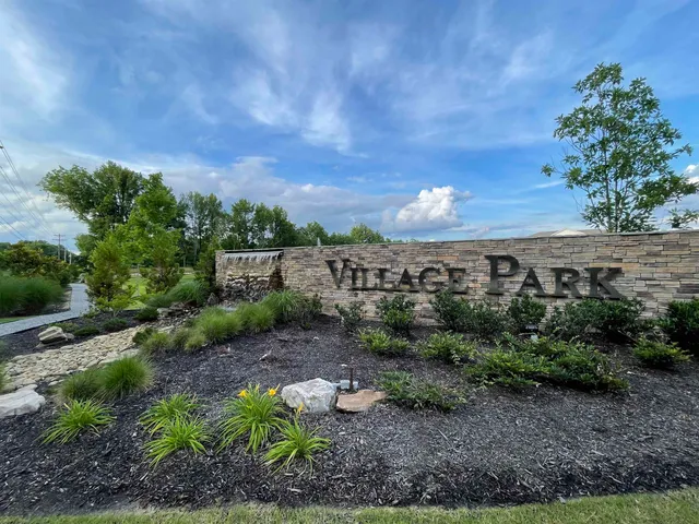 a view of a pathway with a yard