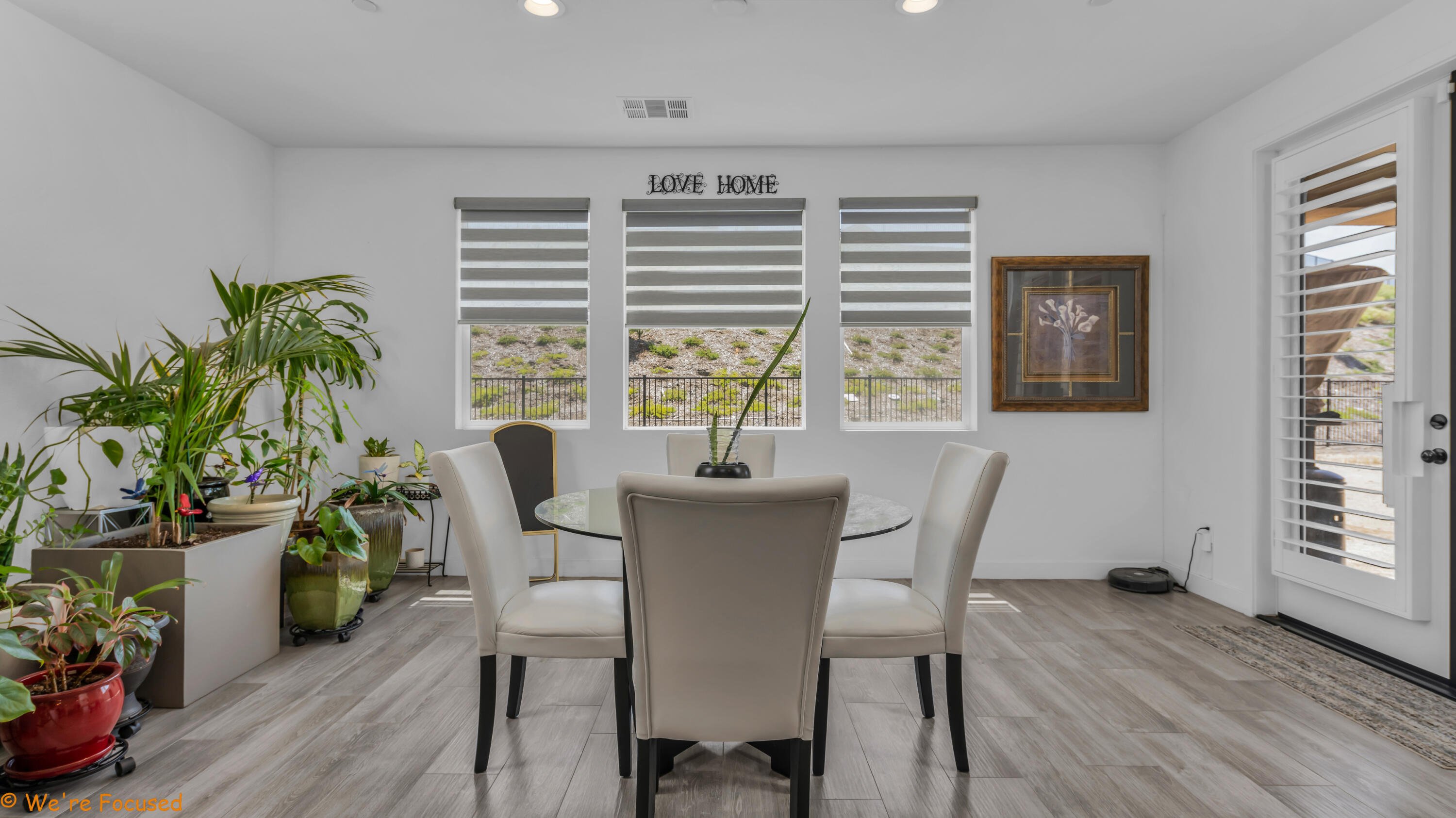 17126 Blue Lake Court Riverside, CA 92503 - Photo 14 of 75 a view of a dining room with furniture and a potted plant