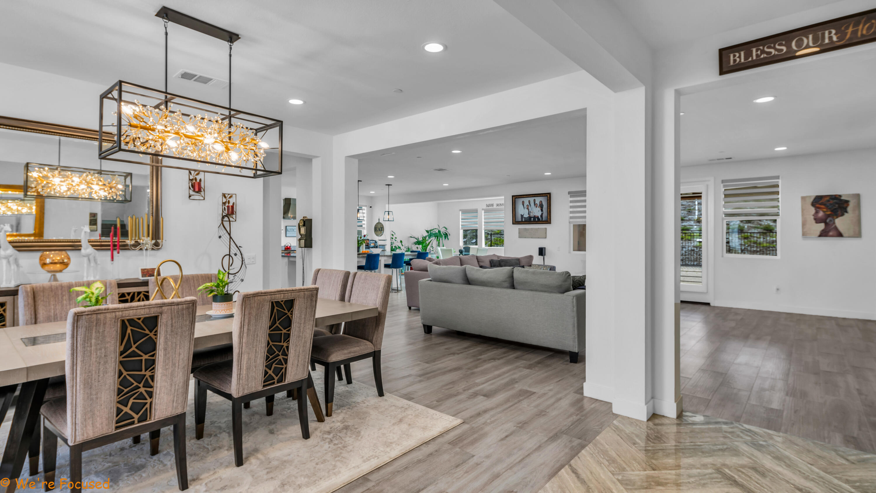 17126 Blue Lake Court Riverside, CA 92503 - Photo 15 of 75 a view of a dining room and livingroom with furniture wooden floor a chandelier