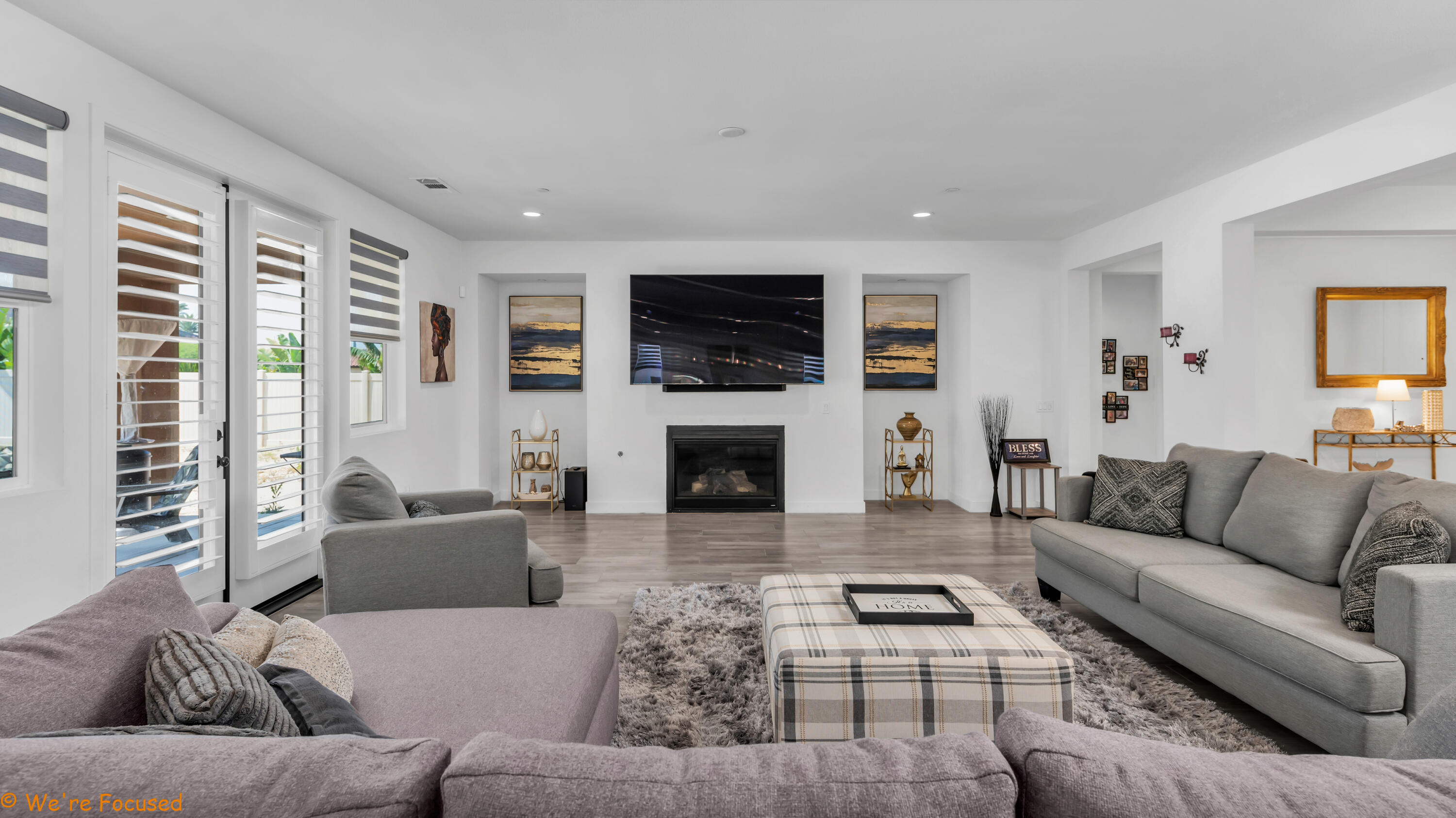 17126 Blue Lake Court Riverside, CA 92503 - Photo 16 of 75 a living room with furniture a flat screen tv and a fireplace