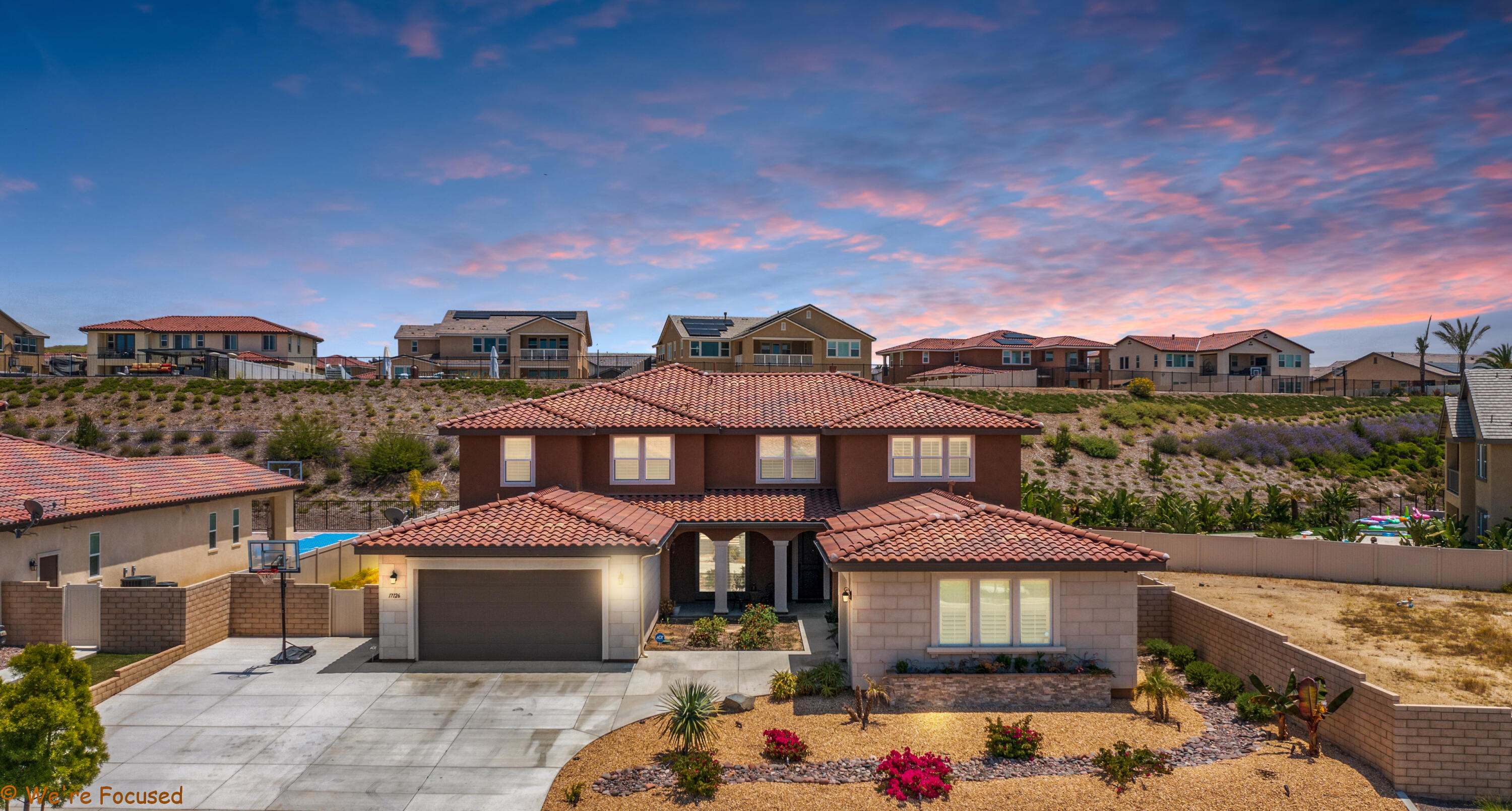 17126 Blue Lake Court Riverside, CA 92503 - Photo 2 of 75 a front view of a house with a yard and balcony