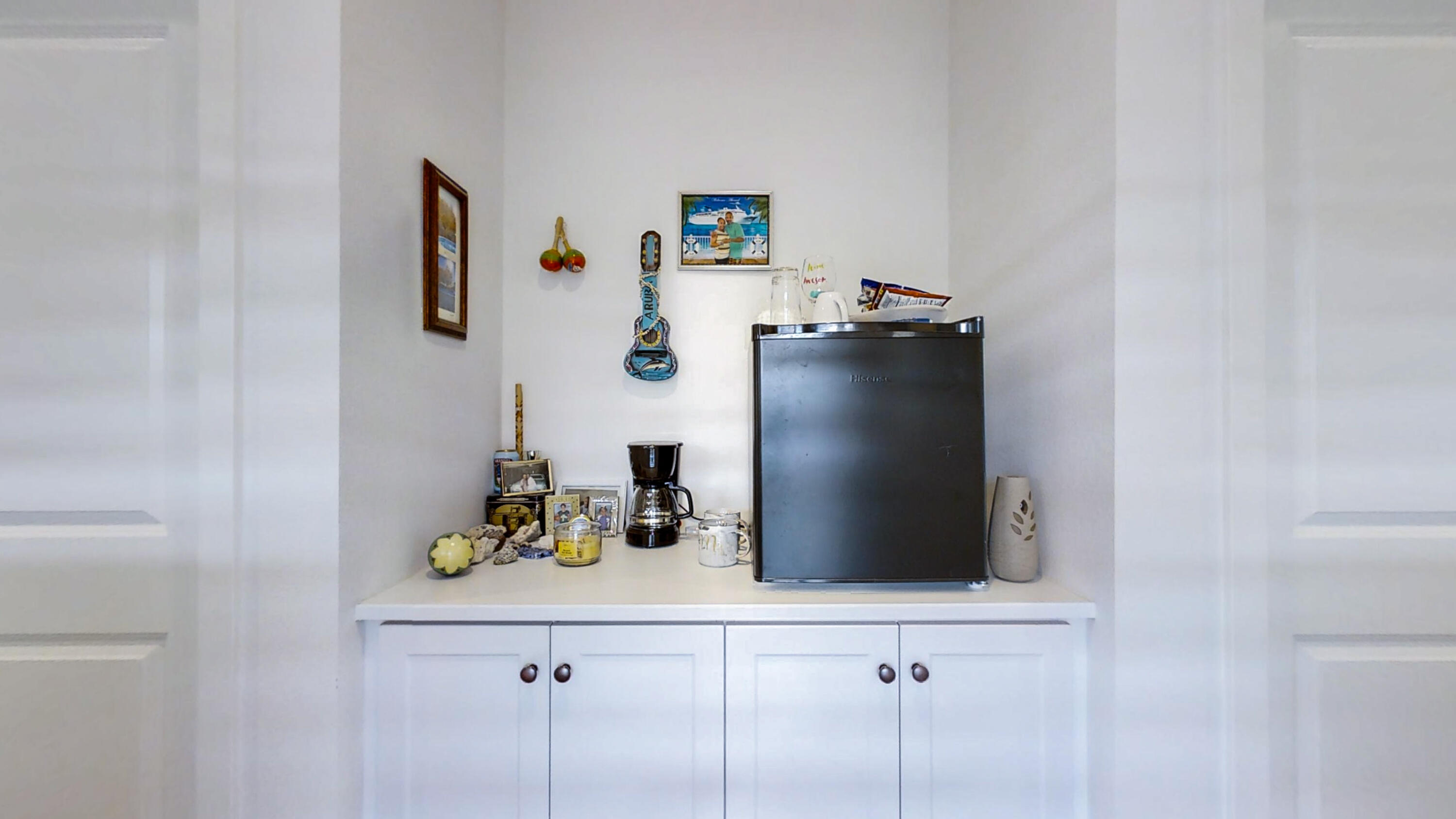 17126 Blue Lake Court Riverside, CA 92503 - Photo 34 of 75 a view of a cabinet with a vase and flowers on it