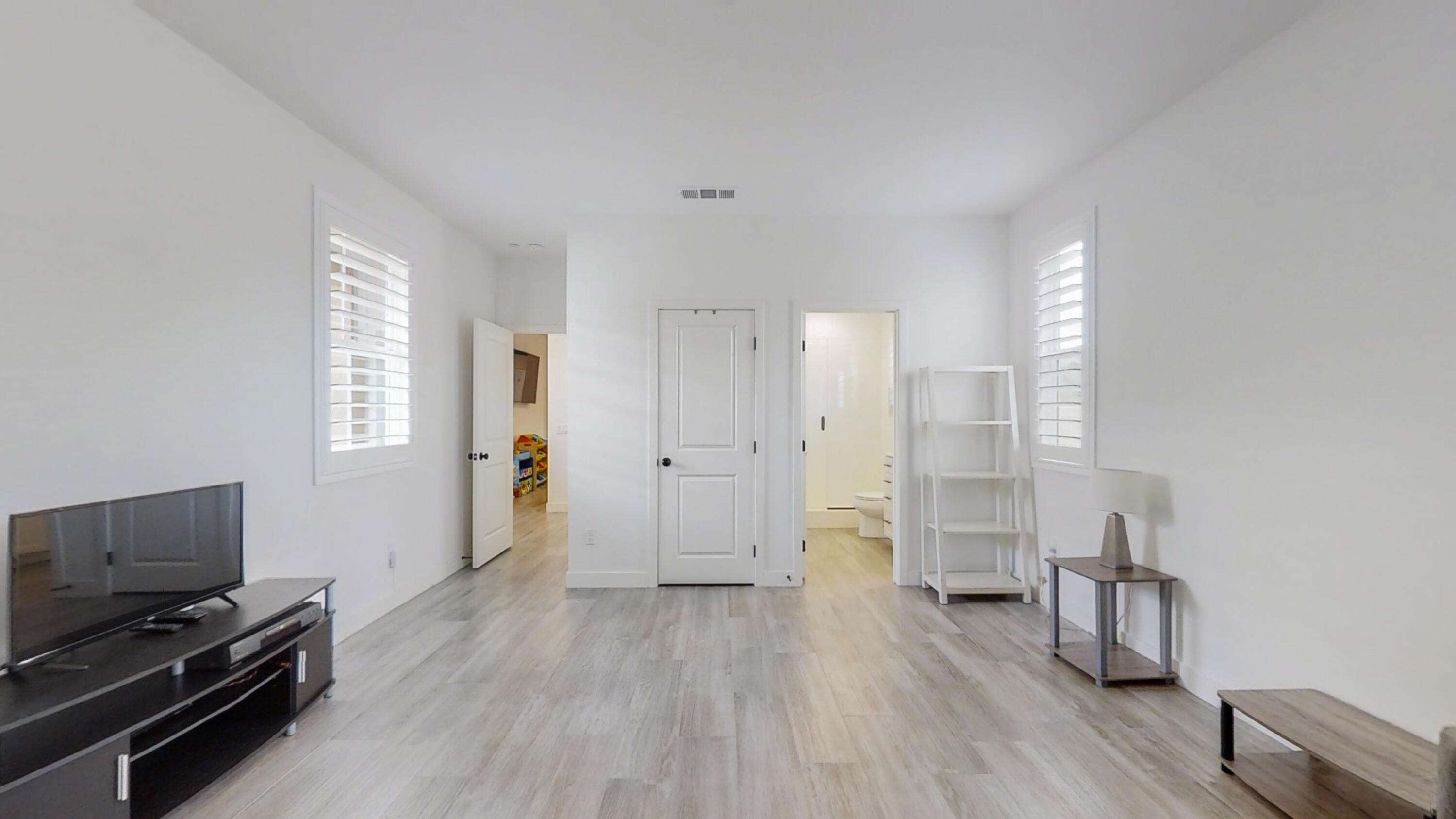 17126 Blue Lake Court Riverside, CA 92503 - Photo 38 of 75 a view of a livingroom with wooden floor and lounge chair