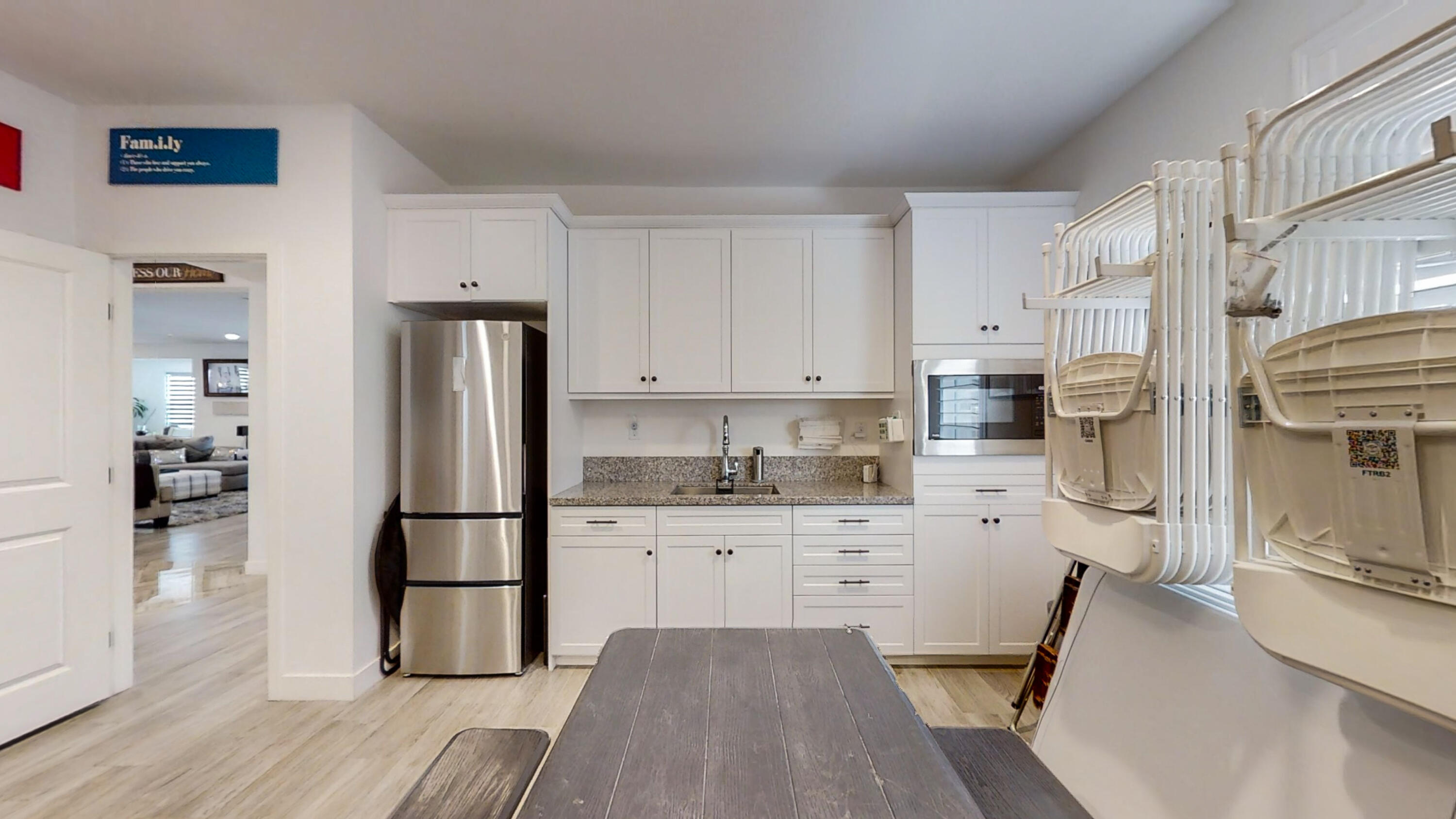 17126 Blue Lake Court Riverside, CA 92503 - Photo 41 of 75 a kitchen with stainless steel appliances a refrigerator sink and cabinets