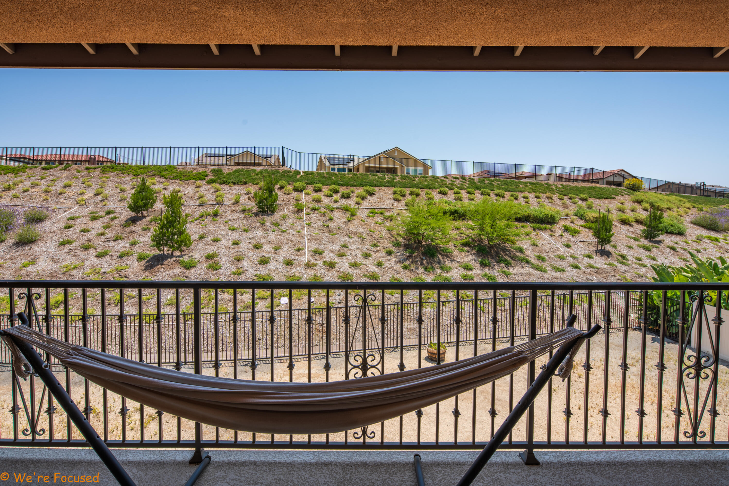17126 Blue Lake Court Riverside, CA 92503 - Photo 60 of 75 a view of a balcony with wooden floor & fence