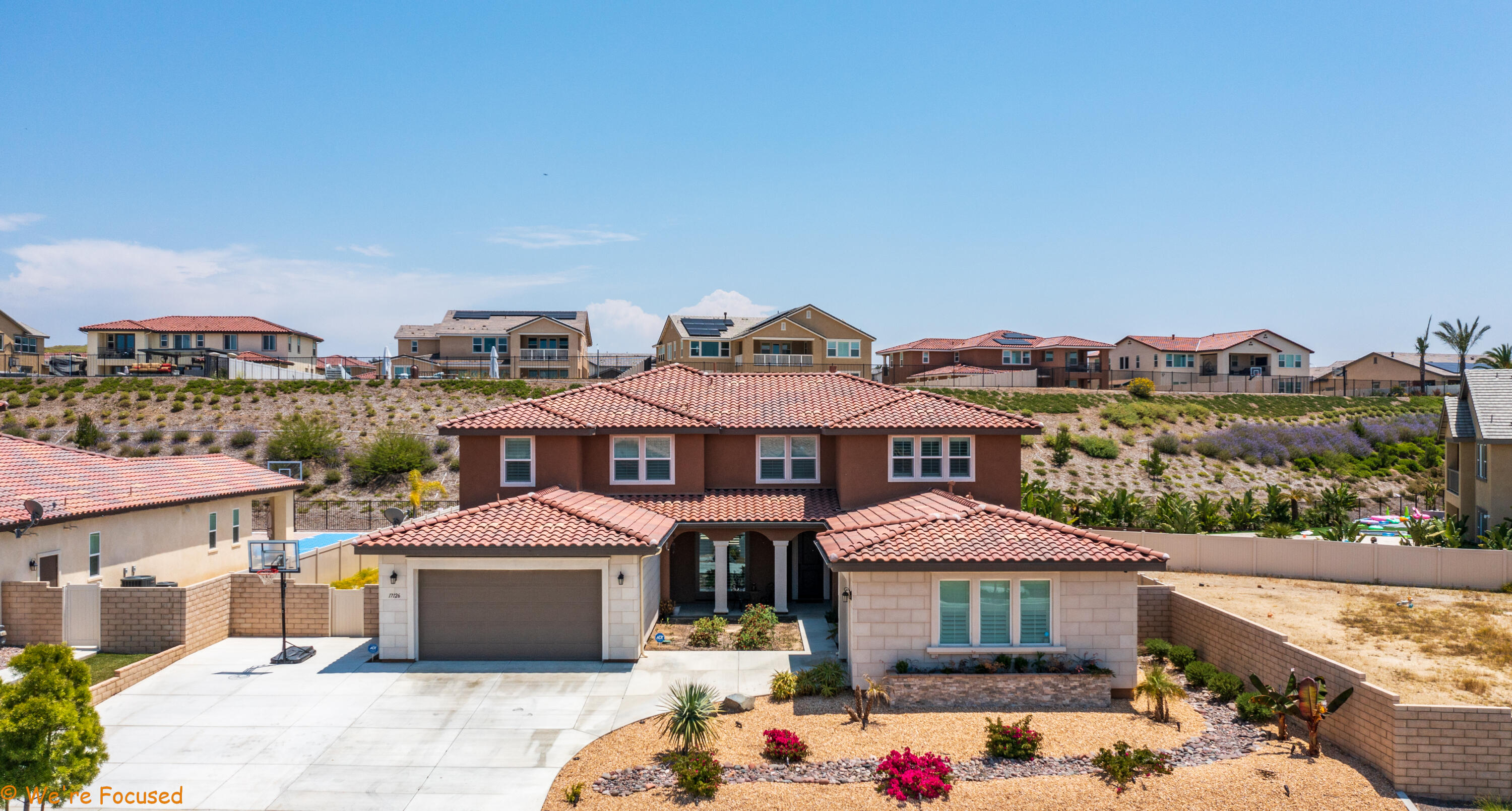 17126 Blue Lake Court Riverside, CA 92503 - Photo 6 of 75 a front view of a house with a yard and balcony
