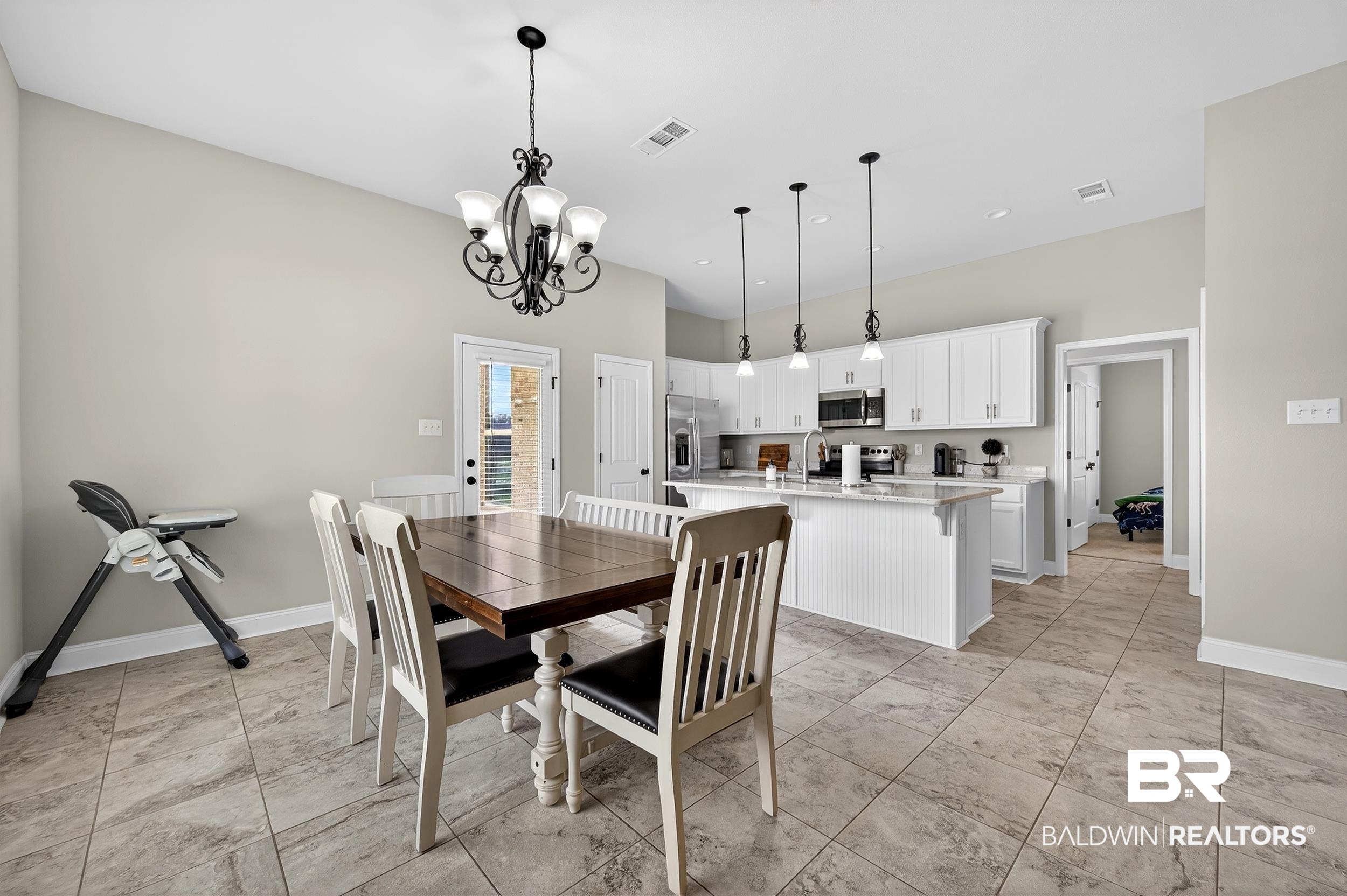 1084 Stella Road Foley, AL 36535 - Photo 10 of 31 Dining room with hanging lights and baseboards