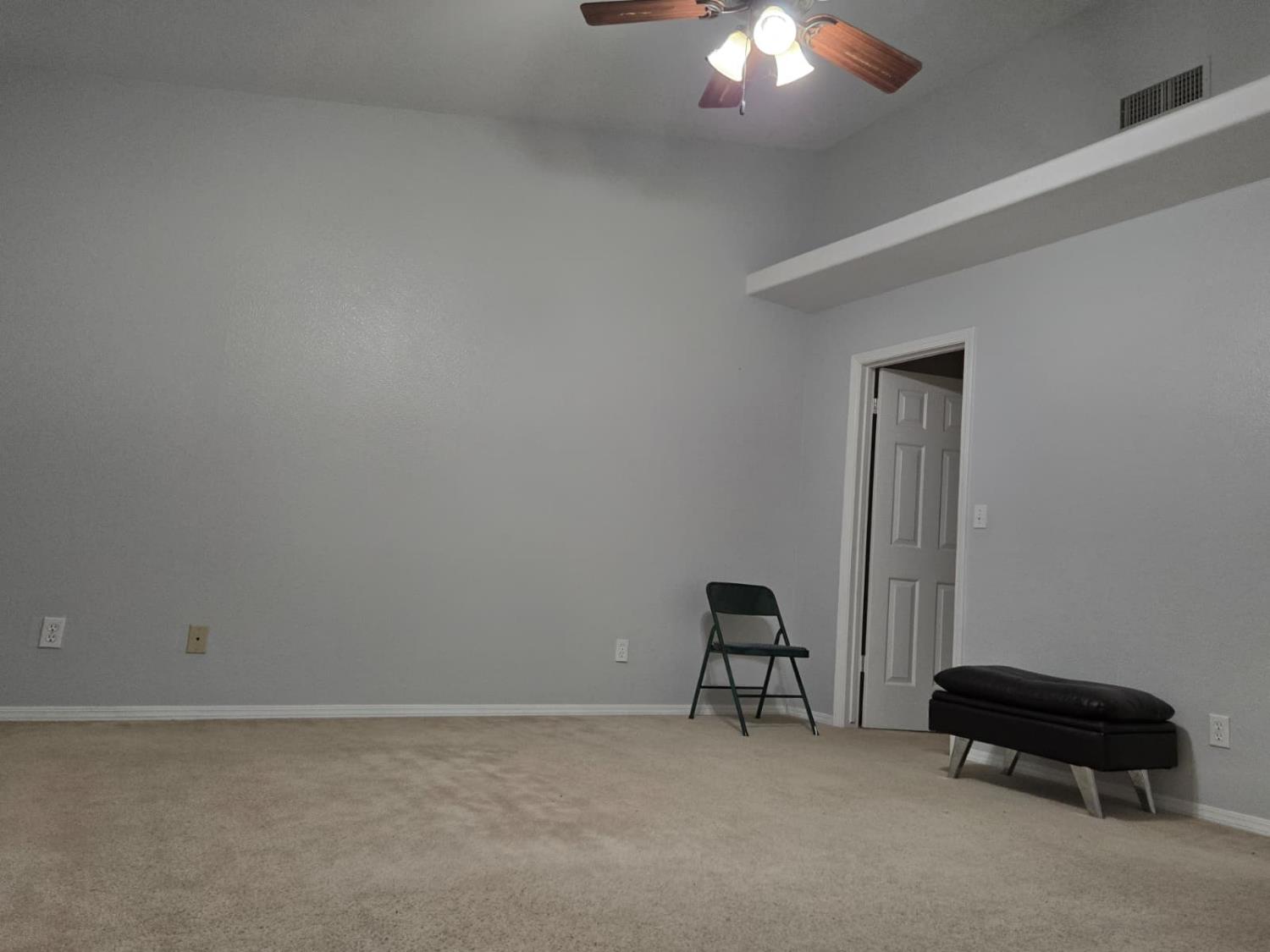 2645 Fowler Avenue Clovis, CA 93611 - Photo 9 of 11 a room with a chair and a potted plant