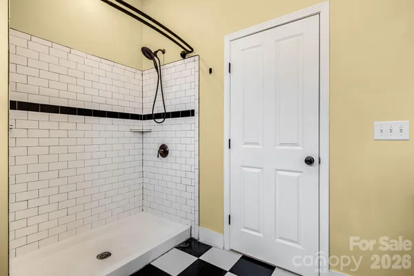 a kitchen with stainless steel appliances granite countertop a stove a refrigerator a sink counter tops and chairs