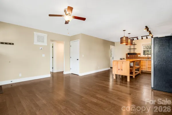 a kitchen with stainless steel appliances granite countertop a stove and white cabinets
