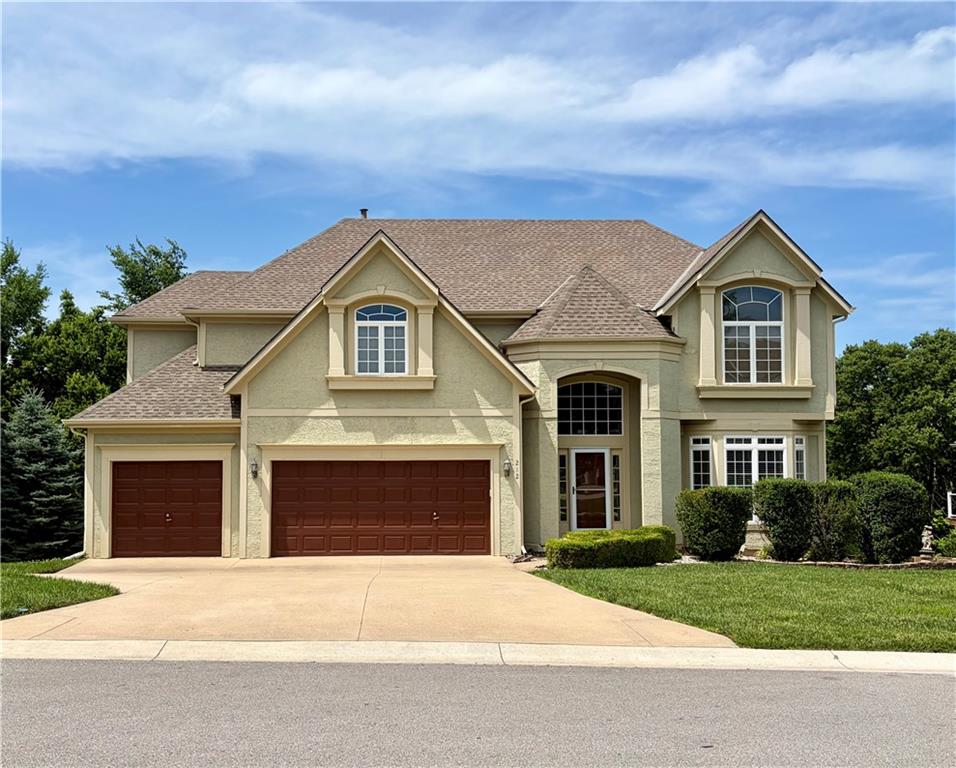 212 Northeast Hidden Ridge Lane Lee's Summit, MO 64064 - Photo 1 of 2