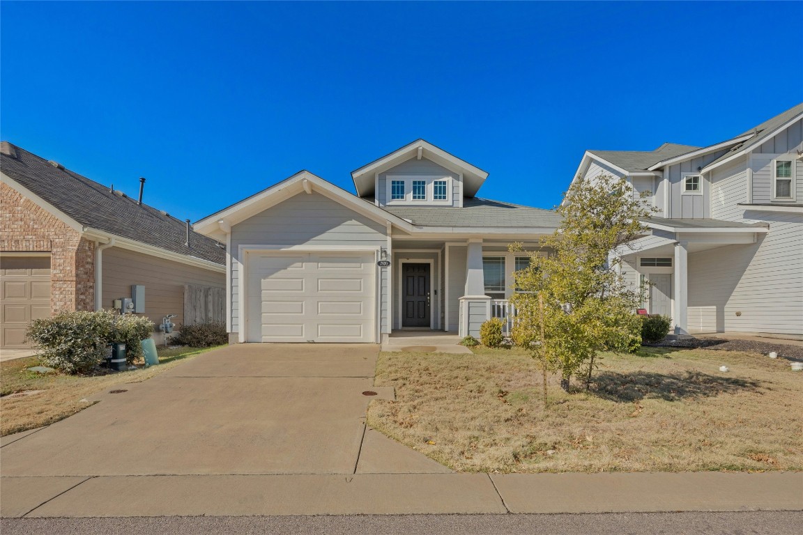 7920 Castelardo Place, Unit 50 Round Rock, TX 78665 - Photo 1 of 28 a front view of a house with garden