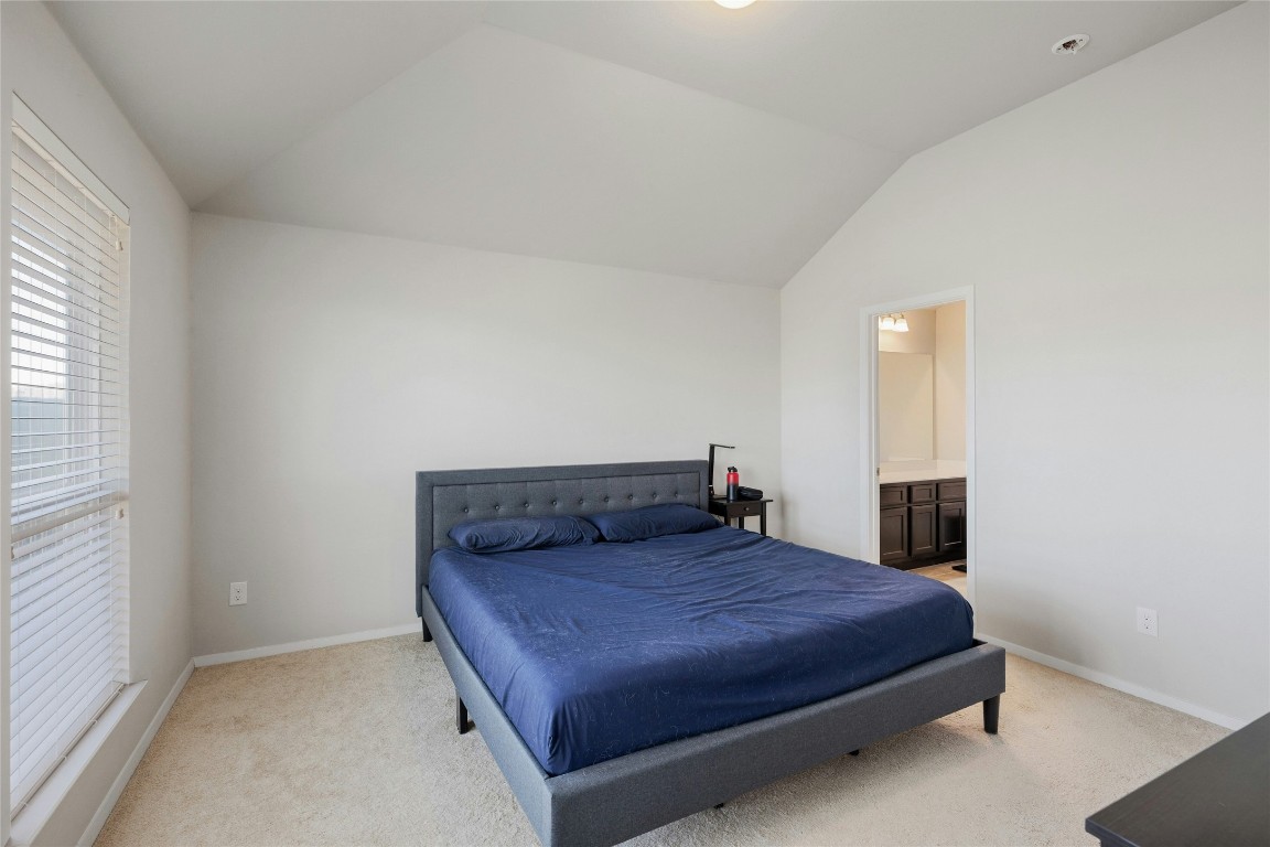 7920 Castelardo Place, Unit 50 Round Rock, TX 78665 - Photo 15 of 28 a bedroom with a bed and window