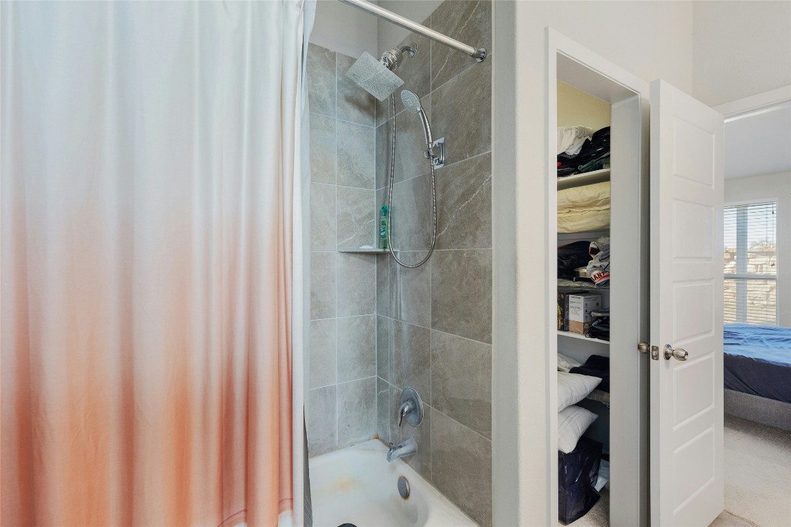 7920 Castelardo Place, Unit 50 Round Rock, TX 78665 - Photo 19 of 28 a bathroom with a shower and a sink