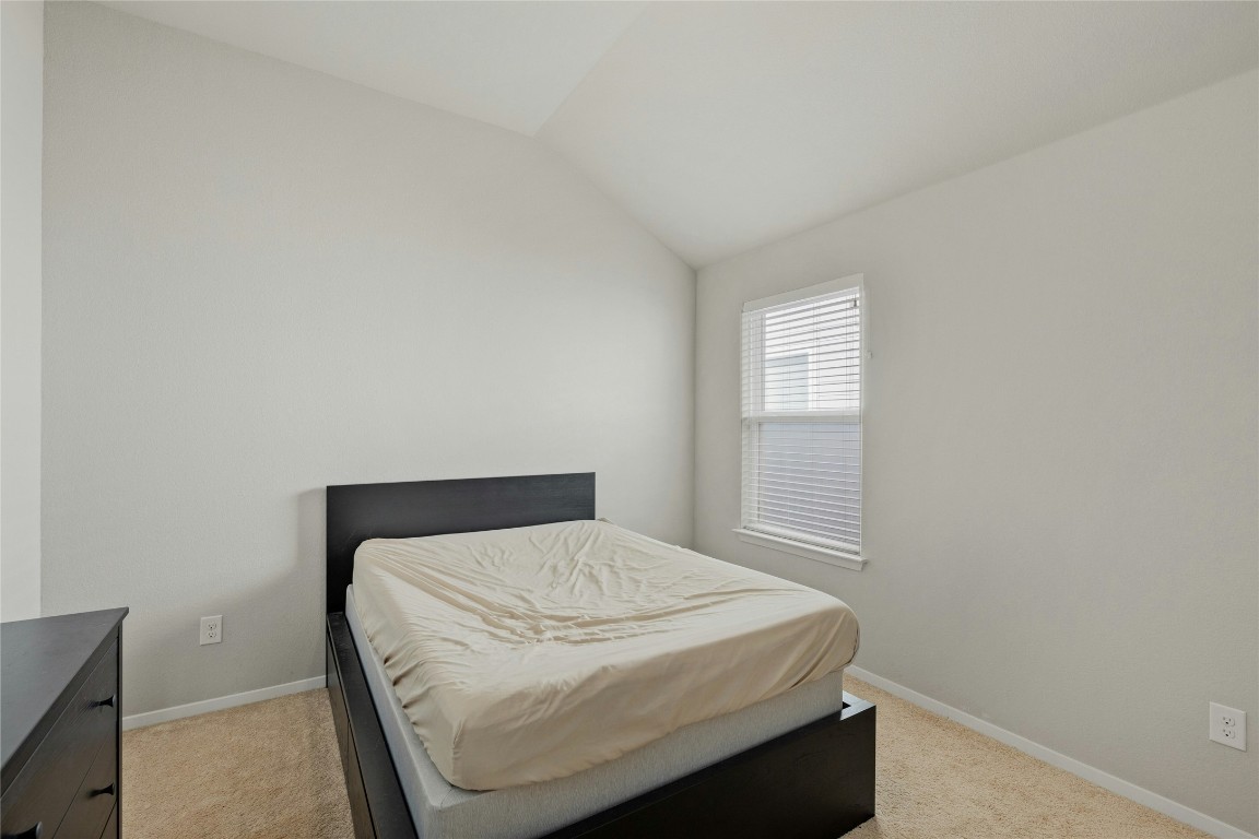 7920 Castelardo Place, Unit 50 Round Rock, TX 78665 - Photo 21 of 28 a bedroom with a bed and window