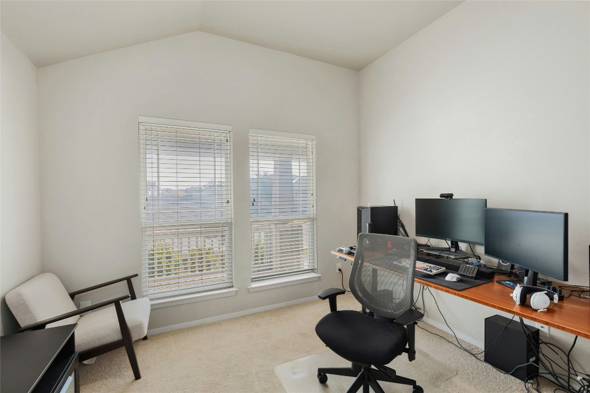 7920 Castelardo Place, Unit 50 Round Rock, TX 78665 - Photo 25 of 28 a view of a workspace with furniture and a window
