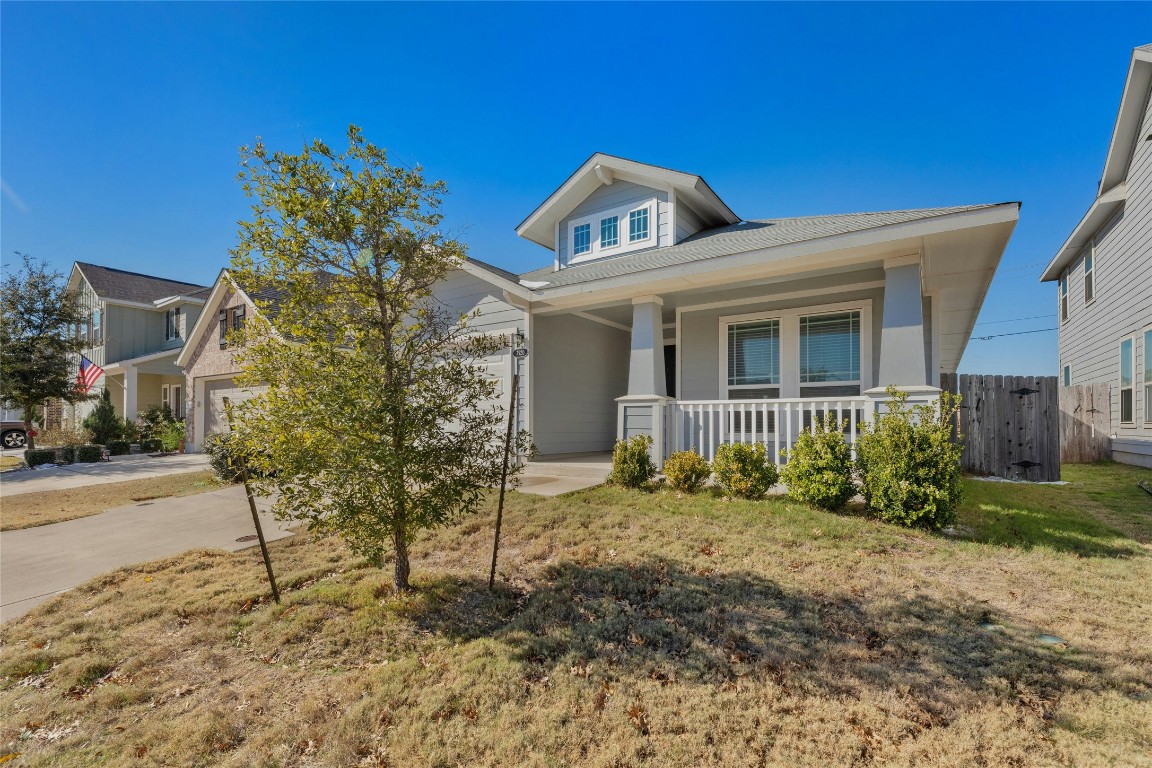 7920 Castelardo Place, Unit 50 Round Rock, TX 78665 - Photo 3 of 28 a front view of a house with garden