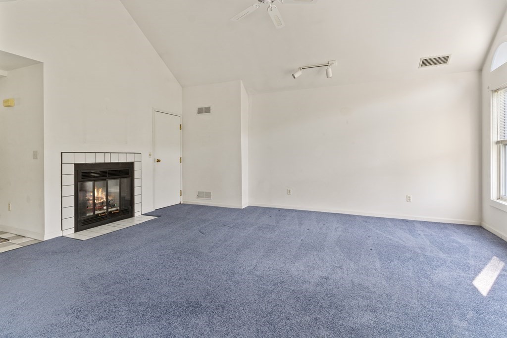 29 Ledgebrook Drive, Unit 29 Blackstone, MA 01504 - Photo 13 of 38 a view of empty room with a fireplace