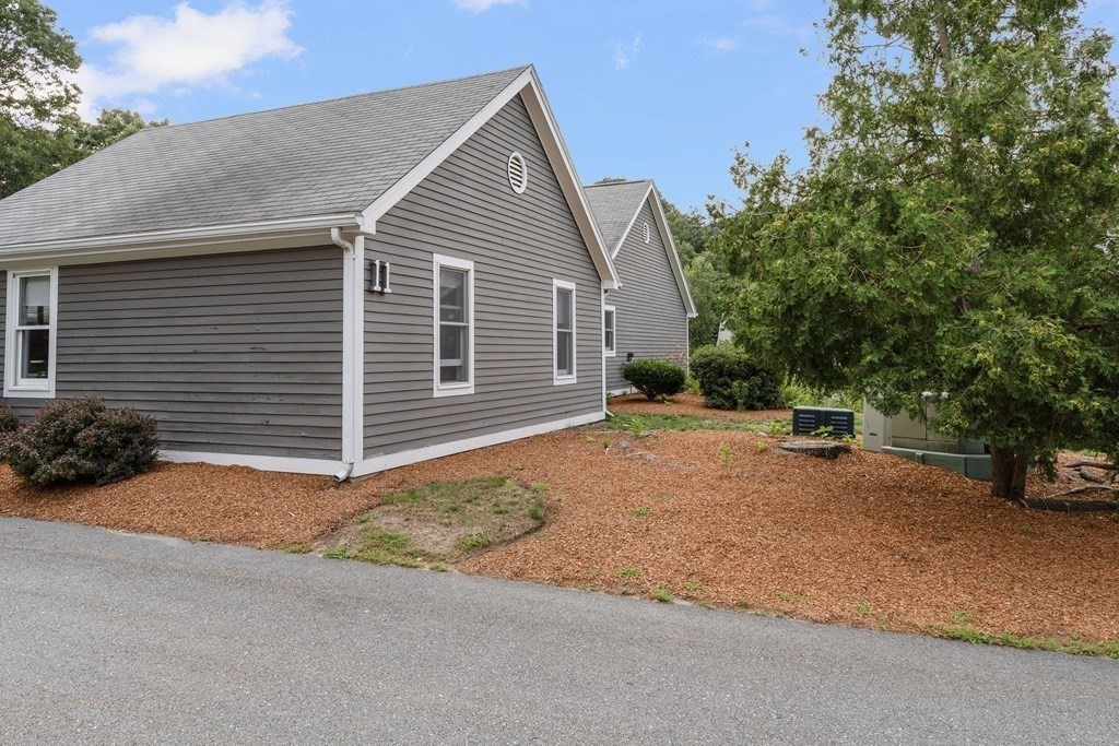 29 Ledgebrook Drive, Unit 29 Blackstone, MA 01504 - Photo 32 of 38 a view of a house with a yard and garage