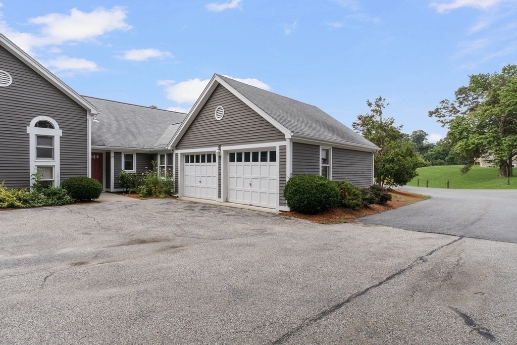 29 Ledgebrook Drive, Unit 29 Blackstone, MA 01504 - Photo 34 of 38 a view of a house with a yard