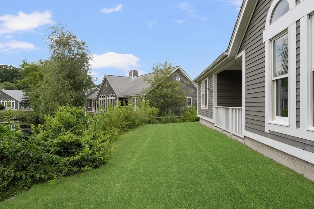 29 Ledgebrook Drive, Unit 29 Blackstone, MA 01504 - Photo 36 of 38 a view of backyard of house with green space