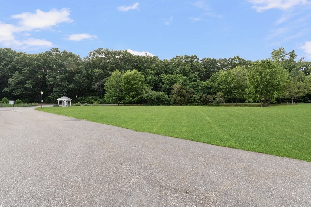 29 Ledgebrook Drive, Unit 29 Blackstone, MA 01504 - Photo 37 of 38 a view of a golf course with a park