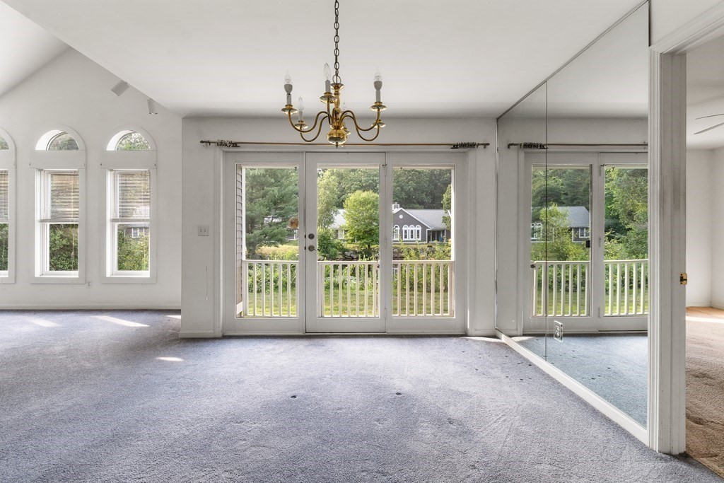 29 Ledgebrook Drive, Unit 29 Blackstone, MA 01504 - Photo 9 of 38 a view of a room with balcony and furniture