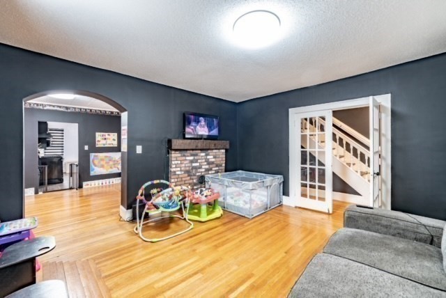 87 Oak Street Springfield, MA 01151 - Photo 5 of 17 a bedroom with furniture and a large window