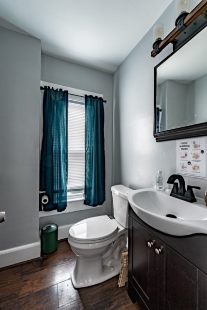 87 Oak Street Springfield, MA 01151 - Photo 10 of 17 a bathroom with a sink a toilet and mirror
