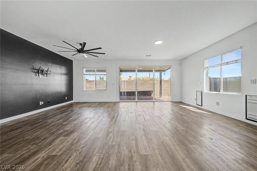 226 Augusta Ridge Henderson, NV 89015 - Photo 2 of 47 This expansive room features durable wood flooring and abundant natural light.