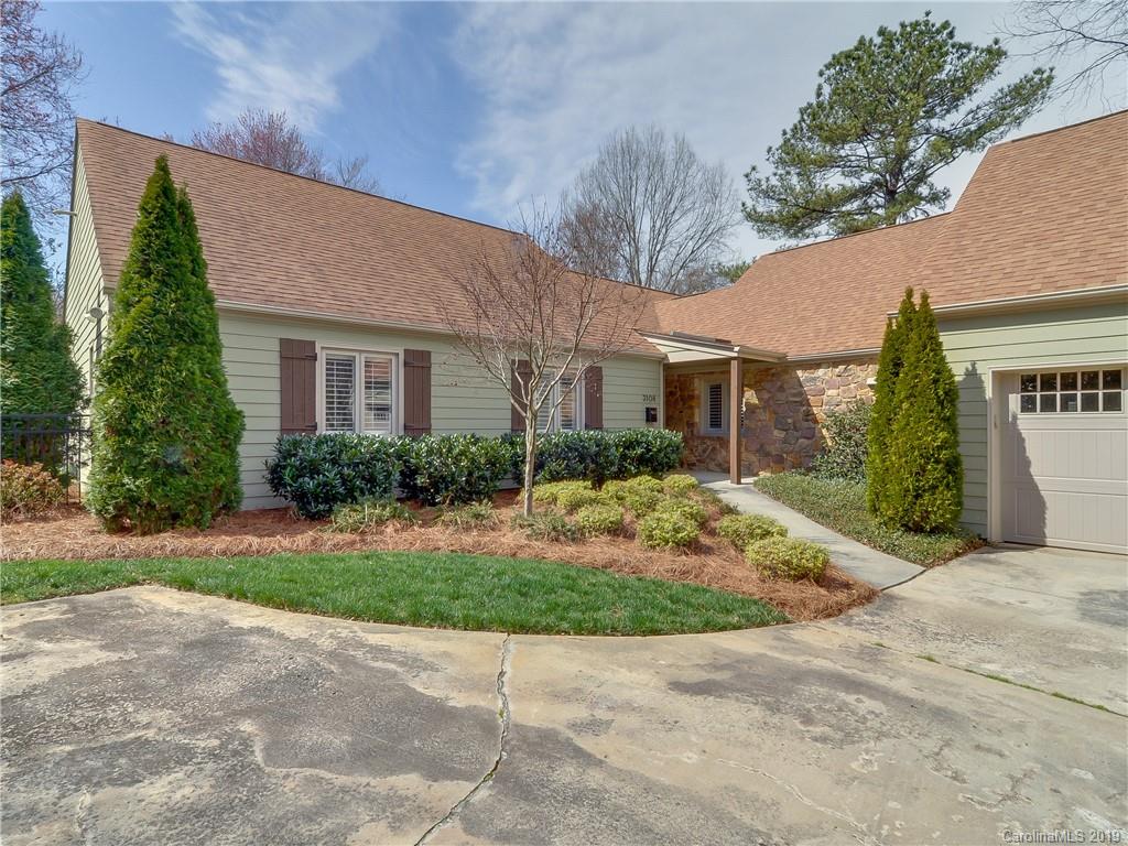 3108 Colony Road Charlotte, NC 28211 - Photo 3 of 36 a view of a brick house with a yard plants and large tree