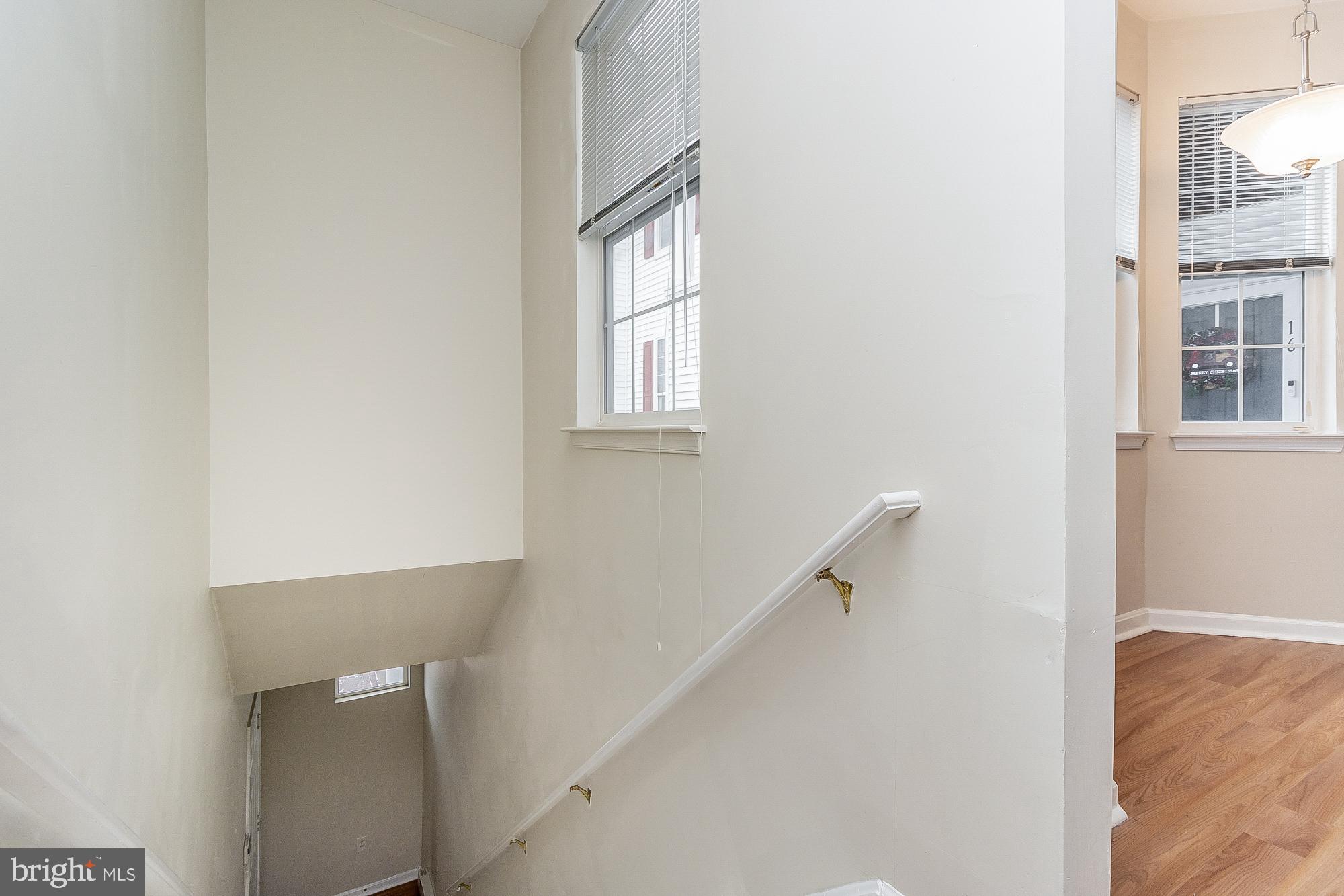 18 Hawk Rise Lane, Unit 205 Owings Mills, MD 21117 - Photo 23 of 29 a view of entryway with a window and wooden floor