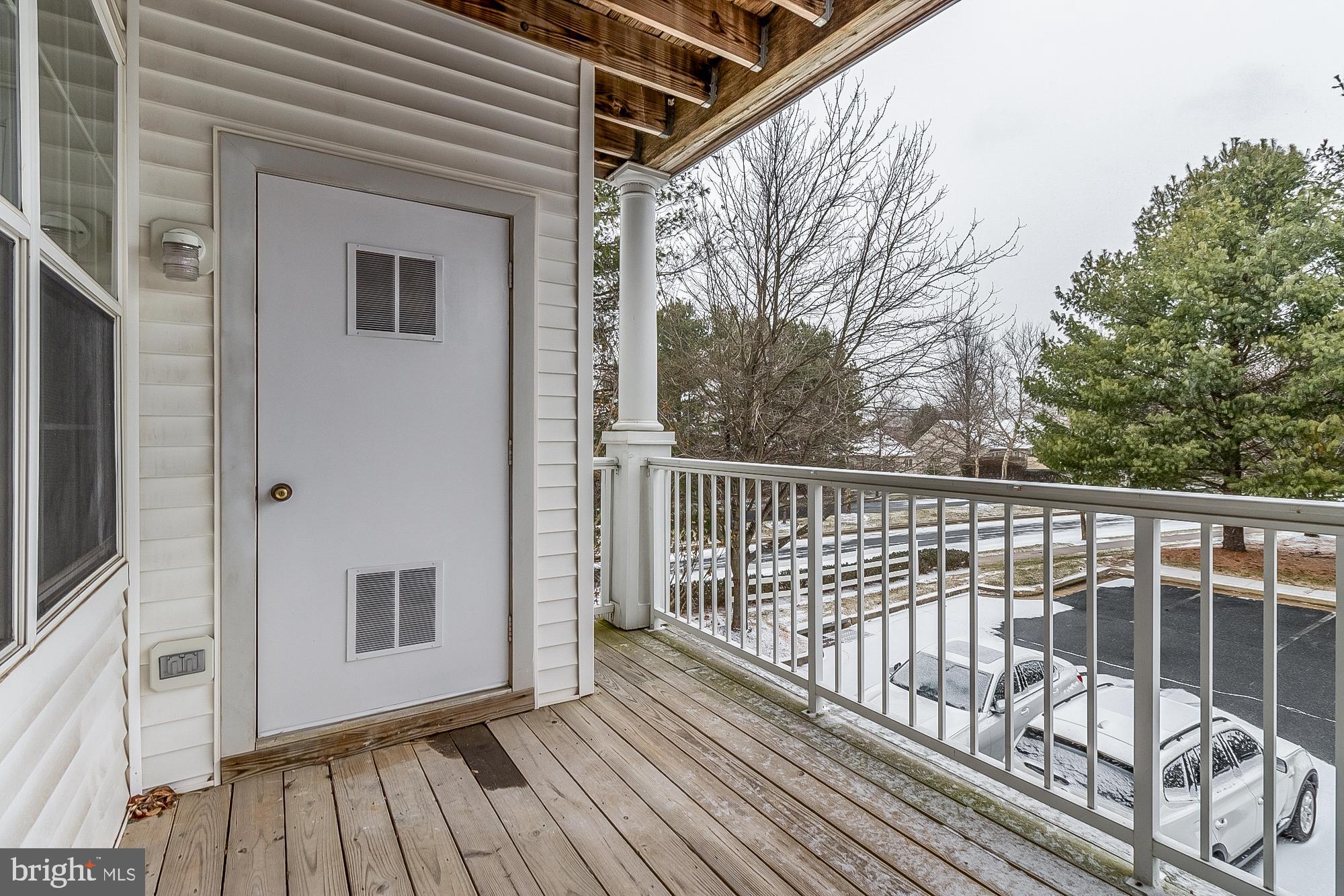 18 Hawk Rise Lane, Unit 205 Owings Mills, MD 21117 - Photo 29 of 29 a view of a balcony with wooden floor