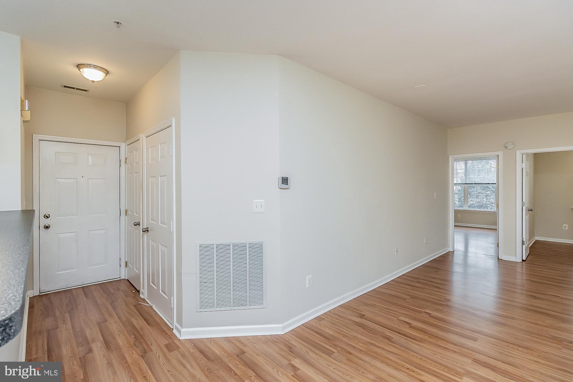 18 Hawk Rise Lane, Unit 205 Owings Mills, MD 21117 - Photo 8 of 29 a view of a hallway with wooden floor