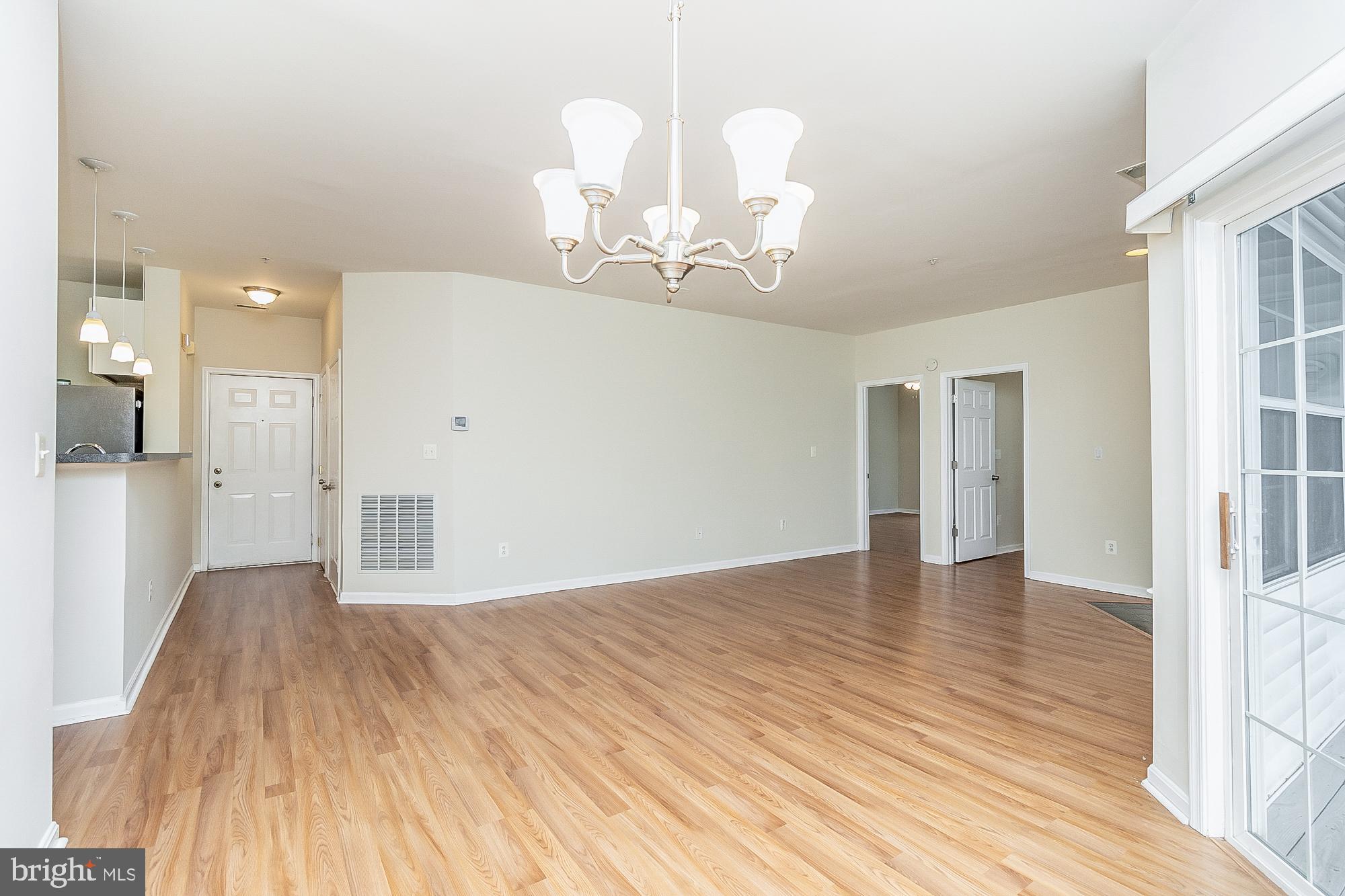 18 Hawk Rise Lane, Unit 205 Owings Mills, MD 21117 - Photo 9 of 29 a view of an empty room with wooden floor