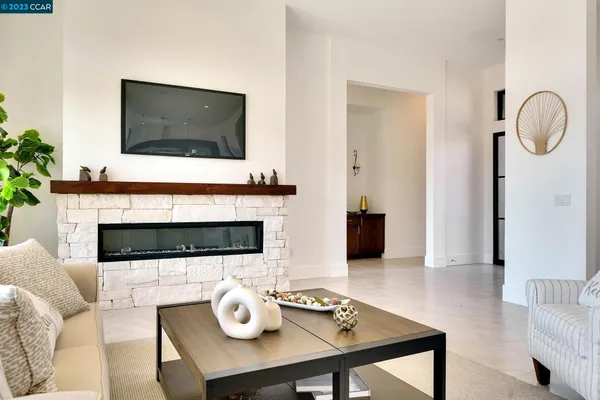 a living room with fireplace furniture and a flat screen tv
