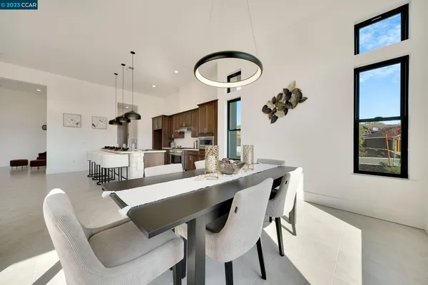 a dining room with furniture and window