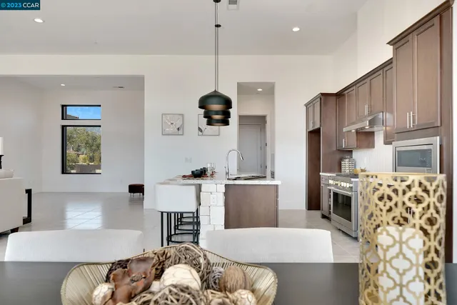 a spacious bedroom with a bed and a large window