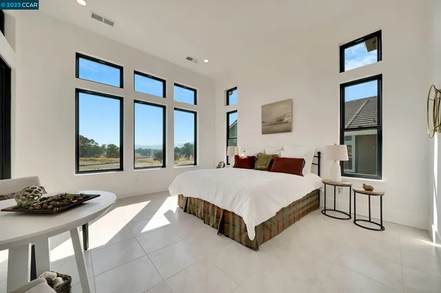 a bed room with a bed and a television