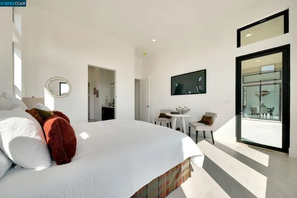a spacious bathroom with double sink and a mirror