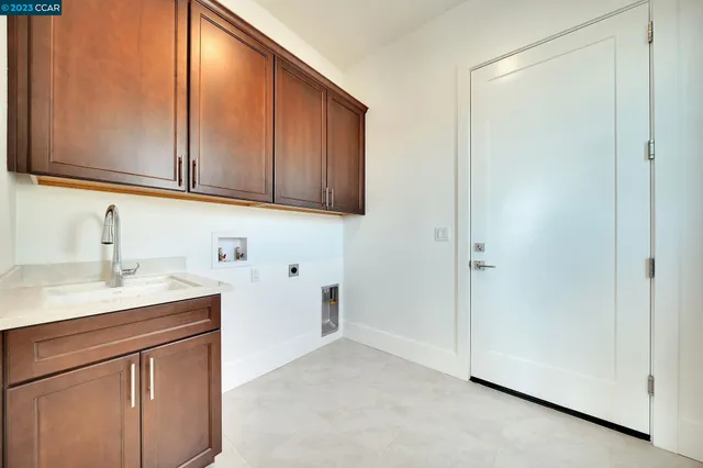 a front view of a house with lots of garage and glass door