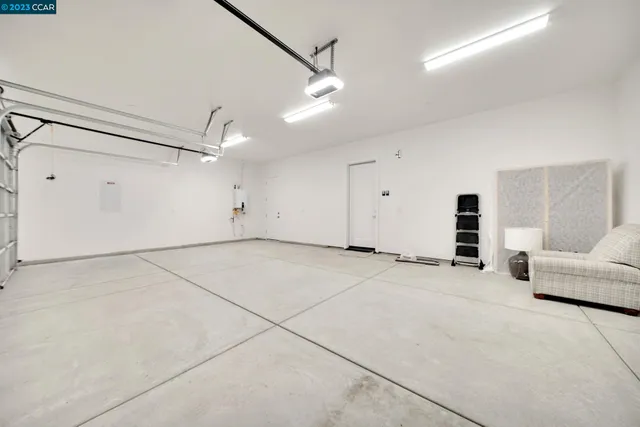 an aerial view of a house with a lake view