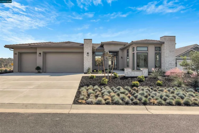 an aerial view of residential house and green space